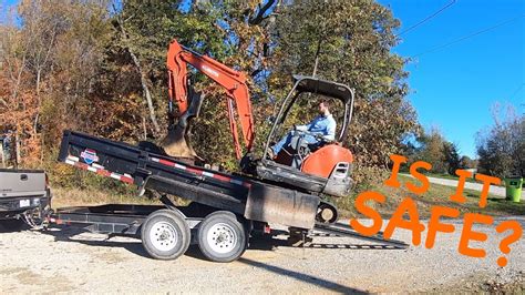 how to load and unload a mini excavator|mini excavator dump trailer.